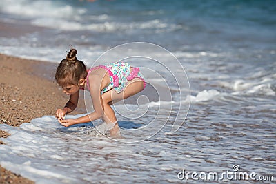 Little girl at the beach Stock Photo